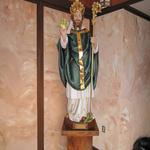 Repaired and repainted St. Patrick, installed in vestibule.  Faux marble applied to wall panels.