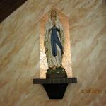 Sanctuary statue repaired, repainted and installed on gold metal leaf background.